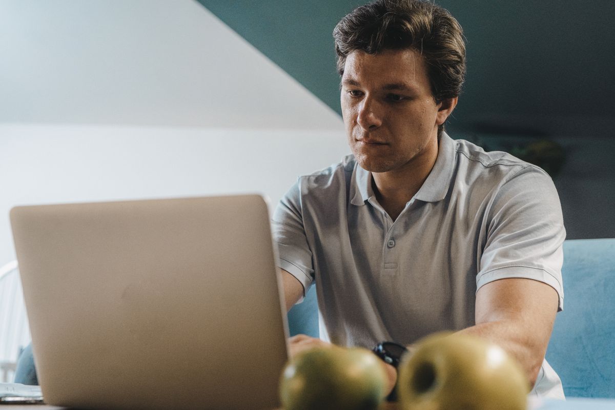 Person working on a laptop from home
